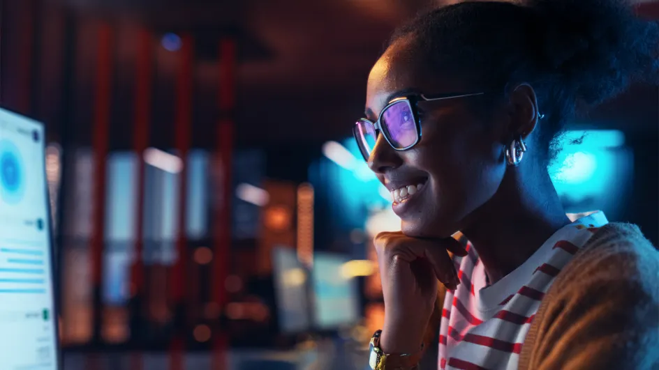 Smiling woman with glasses on working remotely